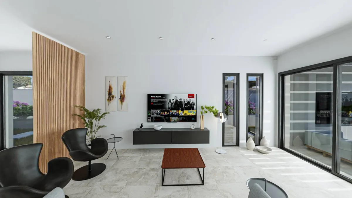 Salón de Casa Oasis con el panel de lamas de madera
