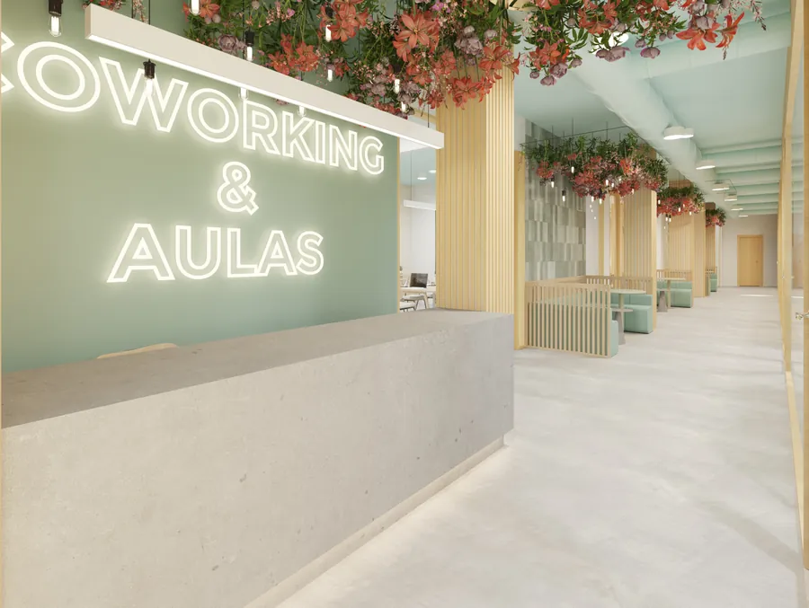 Recepción del coworking con el rótulo luminoso «Coworking & Aulas»